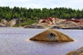 Apocalyptic landscape like a planet Mars surface. Fantastic view of crimson red lake. Solidified red-brown black Earth surface. Royalty Free Stock Photo