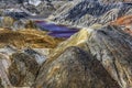 Apocalyptic landscape like a planet Mars surface. Fantastic view of crimson red lake. Solidified red-brown black Earth surface. Royalty Free Stock Photo