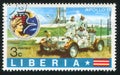 Apollo badge and astronauts on earth in lunar rover