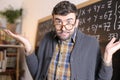 Apologetic teacher in math class Royalty Free Stock Photo