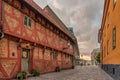 ApoteksgÃÂ¥rden an old half-timbered house in the light of street lamps and the first morning beams Royalty Free Stock Photo