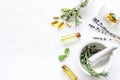 Apothecary of natural wellness and self-care. Herbs and medicine on white background top view frame copy space Royalty Free Stock Photo