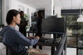 App engineer looking at computer typing machine learning server code Royalty Free Stock Photo