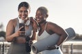 This app shows exactly what to do in our workout. two friends looking at something on a cellphone while out for a Royalty Free Stock Photo