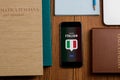 App and textbooks for learning Italian. Books, phone and notepad Royalty Free Stock Photo