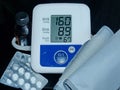 Apparatus for measuring blood pressure. High pressure. Data shows health problems.