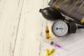 Apparatus for measuring the pressure, cardiogram, syringe, ampoule, pills and dry autumn leaf on white wooden background Royalty Free Stock Photo