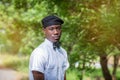 An african man in hat and tie