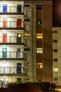 Appartment building with multi color doors at night Royalty Free Stock Photo