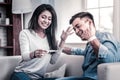 Appealing couple being extremely happy with news