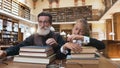 Appealing old bearded man taking off their glasses with his tired 12-aged granddaughter and laying on books after