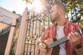 Appealing street musician reaching aim in music Royalty Free Stock Photo