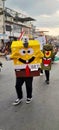 appearance of a carnival participant wearing a sponge Bob costume