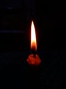 the appearance of a dark red candle flame and silence Royalty Free Stock Photo