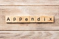 Appendix word written on wood block. appendix text on table, concept Royalty Free Stock Photo