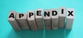 Appendix word written on wood block. appendix text on table, concept Royalty Free Stock Photo