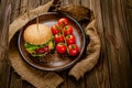 Appetite fresh homemade classic beef burger on rustic wooden serving table. Homemade cooking Royalty Free Stock Photo
