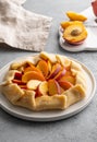 Appetite summer peach galeta on white table with copy space. summer open tart photo for cook book or food blog. Royalty Free Stock Photo