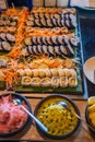 Appetite tasty sushi assortiment with souces on the table at the buffet