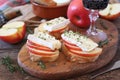 Appetizer. Apples and Camembert cheese bread toast and red wine. Healthy savory sandwich Royalty Free Stock Photo