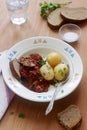 Appetizer from aubergines in a sauce of peppers and tomatoes, served with boiled potatoes. Rustic style, selective focus. Royalty Free Stock Photo