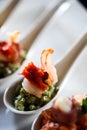 Appetizer with bacon and pesto in a spoon Royalty Free Stock Photo