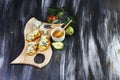 Appetizer bruschetta with pear, honey, walnut and cottage cheese on light wood board. Flat, top view, overhead Royalty Free Stock Photo