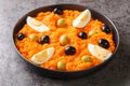 Appetizer of carrot puree served with boiled eggs and olives close-up in a plate. horizontal Royalty Free Stock Photo