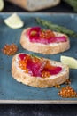 Ciabatta with beet Gravlax salmon with caviar Royalty Free Stock Photo