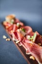 Appetizer with prosciutto and nuts