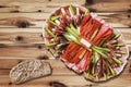 Appetizer Dish Meze With Slice Of Wholegrain Bread Set On Rustic Knotted Pine Wood Garden Table