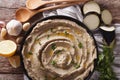 Appetizer of eggplant baba ghanoush closeup in a plate. Horizontal top view