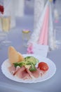 Appetizer a ham and a beautiful table setting at a wedding Royalty Free Stock Photo
