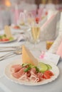 Appetizer a ham and a beautiful table setting at a wedding Royalty Free Stock Photo