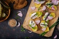 Appetizer of herring anchovy and baked potato. Royalty Free Stock Photo