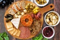 Appetizer platter above scene with a wood background