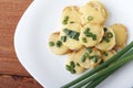 Appetizer of potatoes, cheese and green onions. There is room for text Royalty Free Stock Photo