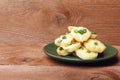 Appetizer of potatoes, cheese and green onions. There is room for text Royalty Free Stock Photo