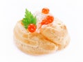 Appetizer with red caviar, gourmet food, party snack. Profiterole with fish mousse or pate and red caviar