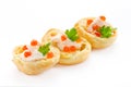 Appetizer with red caviar, gourmet food, party snack. Profiterole with fish mousse or pate and red caviar