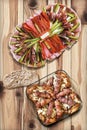 Appetizer Savory Dish With Grilled Minced Meat Loafs Cevapcici And Chicken Thighs Served On Rustic Knotted Pine Wood Table