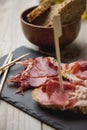 Appetizer Serrano ham with toasted bread Royalty Free Stock Photo