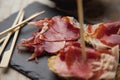 Appetizer Serrano ham with toasted bread Royalty Free Stock Photo