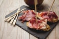 Appetizer Serrano ham with toasted bread Royalty Free Stock Photo