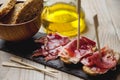 Appetizer Serrano ham with toasted bread Royalty Free Stock Photo