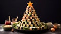 appetizer in shape of Christmas tree from rolls, sushi, red fish, traditional Japanese cuisine on festive New Year\'s table
