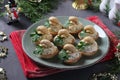 Appetizer in tartlets with mushrooms, egg and cheese on gray background. Delicious holiday snack
