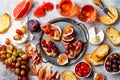 Appetizers, antipasti snacks and rose wine in glasses. Bruschetta or authentic traditional spanish tapas set, cheese and meat Royalty Free Stock Photo