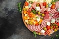 Appetizers or antipasto set with gourmet food. Mixed delicatessen of cheese and meat snacks, Food recipe background. Close up Royalty Free Stock Photo
