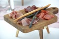 Appetizers boards with assorted meat and salami. Charcuterie platter. Wooden board on a blurry background